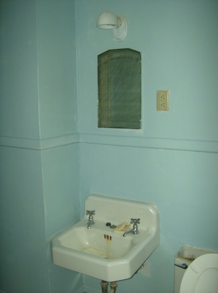 The old sink was falling off the wall